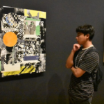 Students observing a painting at the California African American Museum