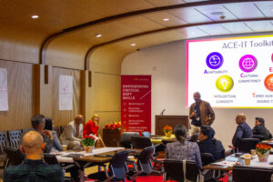 A presenter speaking to a seated audience at USC Annenberg.